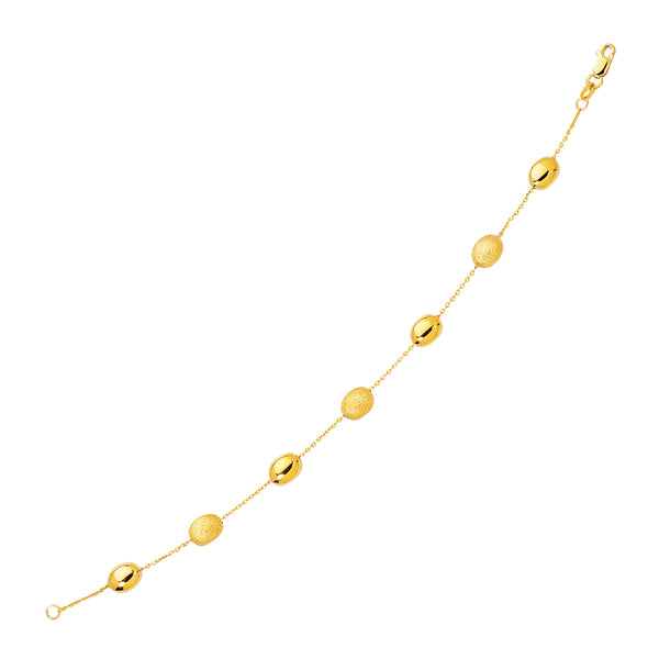 14k Yellow Gold Bracelet with Textured and Polished Pebble Stations (6.35 mm) - Premium Bracelets - Just $545.99! Shop now at Pulse Designer Fashion