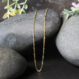 10k Yellow Gold Singapore Chain (1.50 mm) - Premium Chains - Just $171.99! Shop now at Pulse Designer Fashion